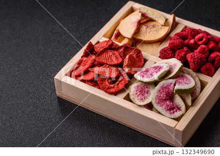 Box of dried fruits strawberries, raspberries, figs and peaches. Dried fruits 132349690