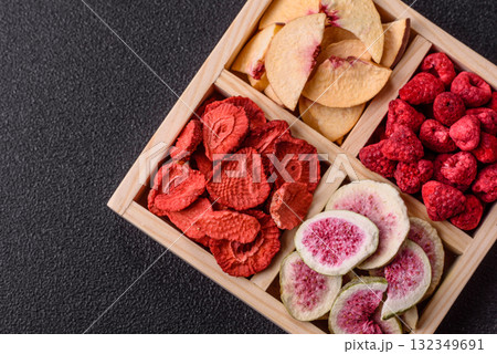 Box of dried fruits strawberries, raspberries, figs and peaches. Dried fruits 132349691