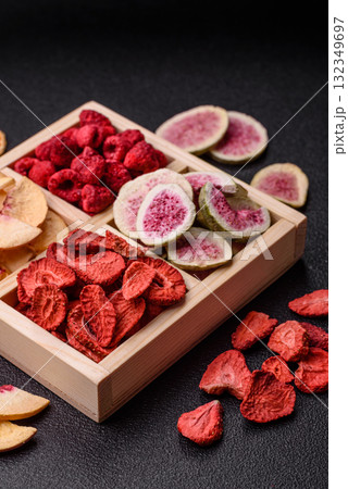 Box of dried fruits strawberries, raspberries, figs and peaches. Dried fruits 132349697