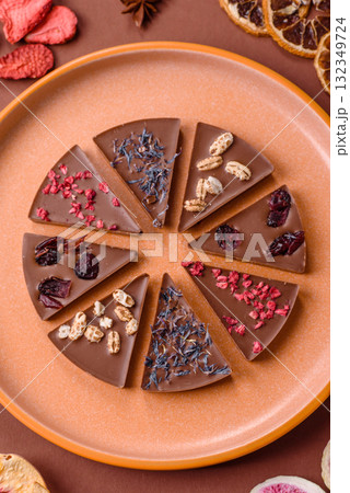 Craft home made chocolate with berries and fruits, delicious sweets. Craft chocolate Craft home made chocolate with berries and fruits, delicious sweets. Craft chocolate 132349724