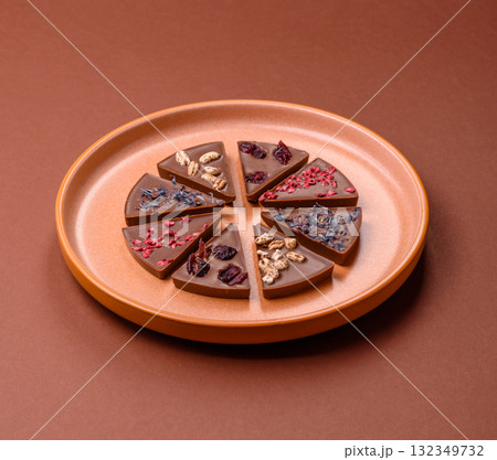 Craft home made chocolate with berries and fruits, delicious sweets. Craft chocolate Craft home made chocolate with berries and fruits, delicious sweets. Craft chocolate 132349732