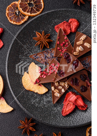 Craft home made chocolate with berries and fruits, delicious sweets. Craft chocolate Craft home made chocolate with berries and fruits, delicious sweets. Craft chocolate 132349739