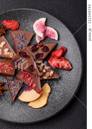 Craft home made chocolate with berries and fruits, delicious sweets. Craft chocolate Craft home made chocolate with berries and fruits, delicious sweets. Craft chocolate 132349743