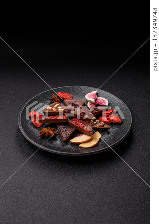Craft home made chocolate with berries and fruits, delicious sweets. Craft chocolate Craft home made chocolate with berries and fruits, delicious sweets. Craft chocolate 132349748