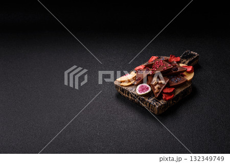 Craft home made chocolate with berries and fruits, delicious sweets. Craft chocolate 132349749
