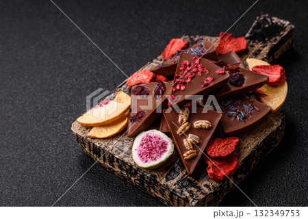 Craft home made chocolate with berries and fruits, delicious sweets. Craft chocolate Craft home made chocolate with berries and fruits, delicious sweets. Craft chocolate 132349753