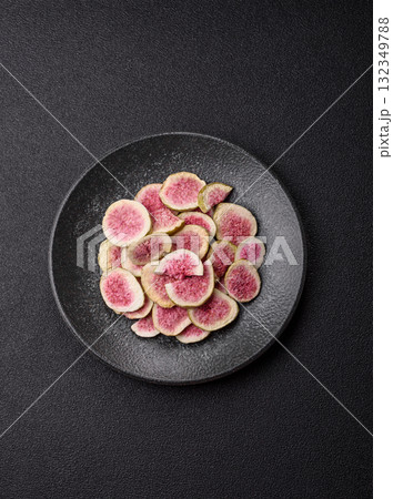 Dried sublimated fig slices as an ingredient for sweet desserts. Dried figs Dried sublimated fig slices as an ingredient for sweet desserts. Dried figs 132349788