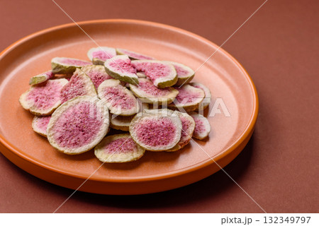 Dried sublimated fig slices as an ingredient for sweet desserts. Dried figs Dried sublimated fig slices as an ingredient for sweet desserts. Dried figs 132349797