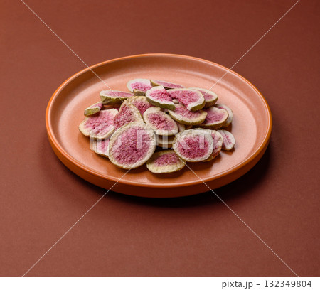 Dried sublimated fig slices as an ingredient for sweet desserts. Dried figs 132349804