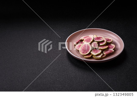 Dried sublimated fig slices as an ingredient for sweet desserts. Dried figs Dried sublimated fig slices as an ingredient for sweet desserts. Dried figs 132349805