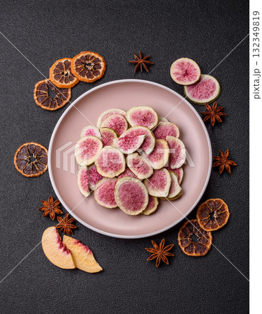 Dried sublimated fig slices as an ingredient for sweet desserts. Dried figs Dried sublimated fig slices as an ingredient for sweet desserts. Dried figs 132349819
