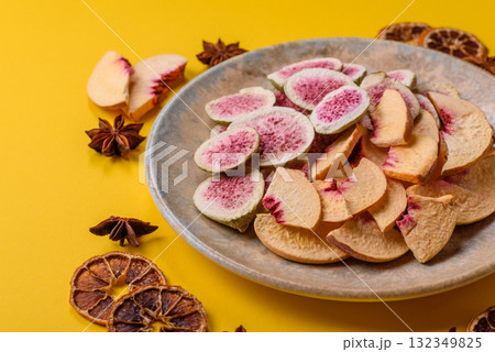 Dried sublimated fig and peach slices as an ingredient for desserts. Dried figs and peaches 132349825
