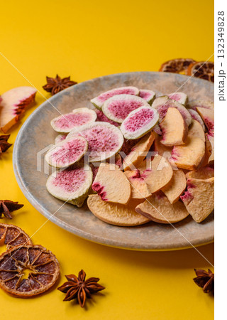Dried sublimated fig and peach slices as an ingredient for desserts. Dried figs and peaches Dried sublimated fig and peach slices as an ingredient for desserts. Dried figs and peaches 132349828