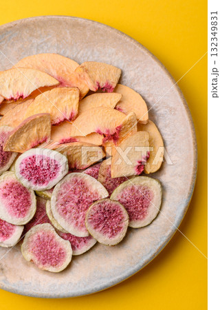Dried sublimated fig and peach slices as an ingredient for desserts. Dried figs and peaches Dried sublimated fig and peach slices as an ingredient for desserts. Dried figs and peaches 132349831