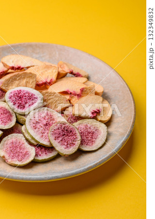 Dried sublimated fig and peach slices as an ingredient for desserts. Dried figs and peaches Dried sublimated fig and peach slices as an ingredient for desserts. Dried figs and peaches 132349832