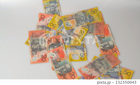 Australian dollar banknotes scattered on white background 132350043