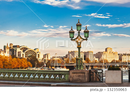 Historic street lamp on Westminster Bridge with view of the Embankment and Hungerford Bridge in London Historic street lamp on Westminster Bridge with view of the Embankment and Hungerford Bridge in London 132350063