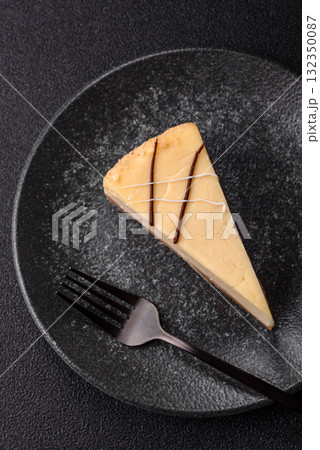 A piece of sweet New York cheesecake, dessert, cheese and vanilla pie. Classic cheesecake A piece of sweet New York cheesecake, dessert, cheese and vanilla pie. Classic cheesecake 132350087