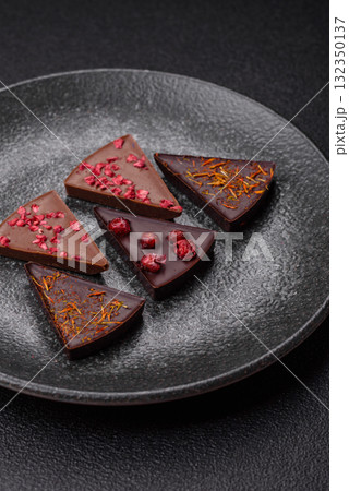 Craft home made chocolate with berries and fruits, delicious sweets. Craft chocolate Craft home made chocolate with berries and fruits, delicious sweets. Craft chocolate 132350137