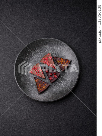Craft home made chocolate with berries and fruits, delicious sweets. Craft chocolate Craft home made chocolate with berries and fruits, delicious sweets. Craft chocolate 132350139