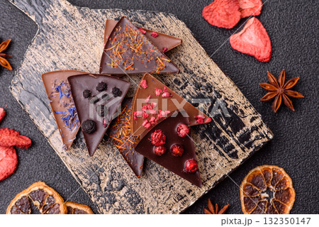 Craft home made chocolate with berries and fruits, delicious sweets. Craft chocolate Craft home made chocolate with berries and fruits, delicious sweets. Craft chocolate 132350147