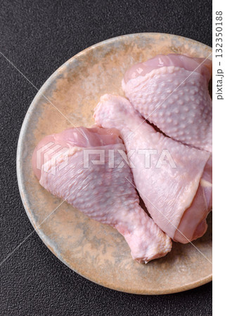 Raw chicken or turkey legs as a food background for cooking on a barbecue or grill. Chicken raw legs 132350188