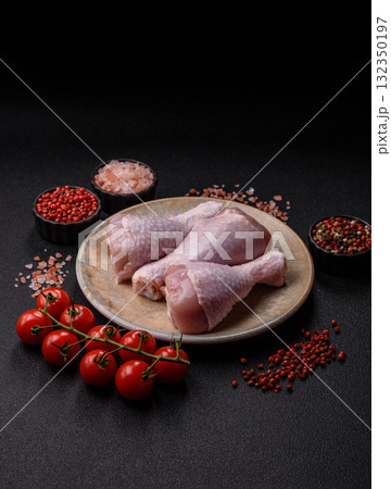 Raw chicken or turkey legs as a food background for cooking on a barbecue or grill. Chicken raw legs 132350197