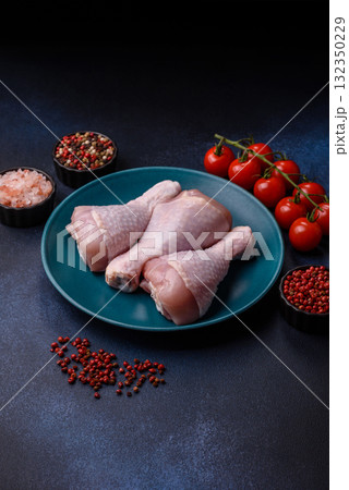 Raw chicken or turkey legs as a food background for cooking on a barbecue or grill. Chicken raw legs 132350229