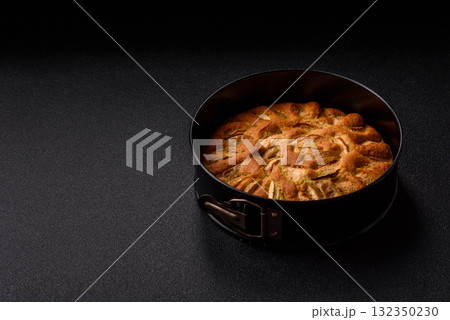 Apple or pear sweet pie for Halloween, hot baking in autumn. Apple pie Apple or pear sweet pie for Halloween, hot baking in autumn. Apple pie 132350230