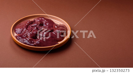 Raw fresh chicken or turkey liver, internal offal of poultry. Raw chicken liver Raw fresh chicken or turkey liver, internal offal of poultry. Raw chicken liver 132350273