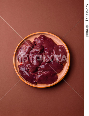 Raw fresh chicken or turkey liver, internal offal of poultry. Raw chicken liver Raw fresh chicken or turkey liver, internal offal of poultry. Raw chicken liver 132350275