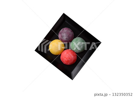Japanese mochi, ice cream or Asian sweets with fruit filling. Mochi of different colors 132350352