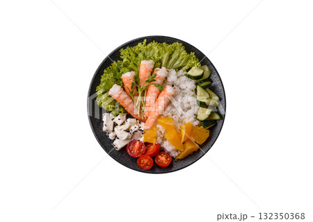 Bowl with shrimps, seafood, rice, oranges, tomatoes with sauce. Bowl with prawns 132350368