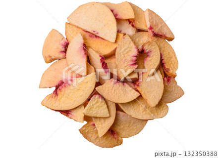 Dried sublimated slices of peach or apricot as an ingredient for sweet desserts. Dried peach Dried sublimated slices of peach or apricot as an ingredient for sweet desserts. Dried peach 132350388