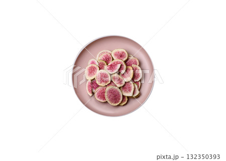 Dried sublimated fig slices as an ingredient for sweet desserts. Dried figs Dried sublimated fig slices as an ingredient for sweet desserts. Dried figs 132350393