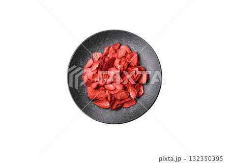 Dried sublimated slices of strawberry as an ingredient for sweet desserts. Dried strawberry 132350395