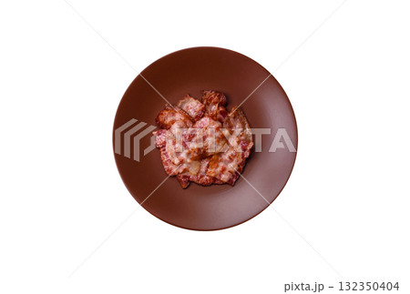 Cooked crispy fried pork bacon strips for a hearty breakfast. Fried bacon strips 132350404