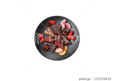 Craft home made chocolate with berries and fruits, delicious sweets. Craft chocolate Craft home made chocolate with berries and fruits, delicious sweets. Craft chocolate 132350410