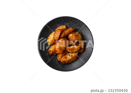 Potato wedges baked with spices, garlic and rosemary. Potato wedges Potato wedges baked with spices, garlic and rosemary. Potato wedges 132350430