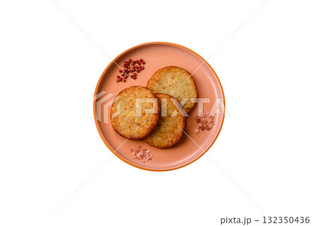 Hash browns, fried potato and onion pancakes with spices for breakfast. Fried hash browns 132350436