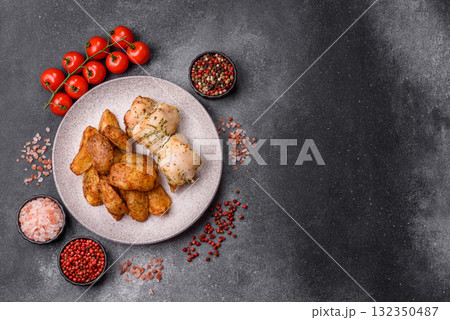Potato wedges baked with spices, garlic and rosemary. Potato wedges Potato wedges baked with spices, garlic and rosemary. Potato wedges 132350487