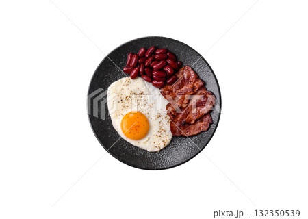 Fried egg, bacon and beans, a classic British breakfast with tomatoes. Egg, bacon and beans 132350539