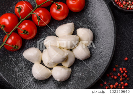 Mozzarella cheese balls, fresh white mini slices for Mediterranean food. Mozzarella cheese 132350640