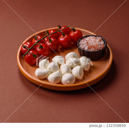 Mozzarella cheese balls, fresh white mini slices for Mediterranean food. Mozzarella cheese Mozzarella cheese balls, fresh white mini slices for Mediterranean food. Mozzarella cheese 132350650