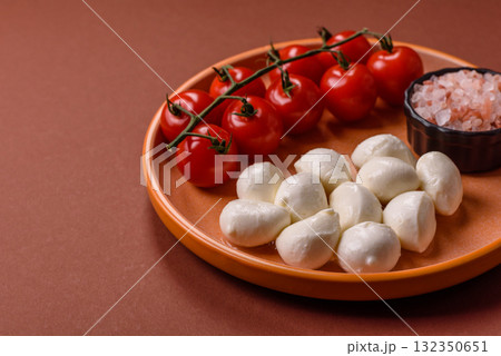 Mozzarella cheese balls, fresh white mini slices for Mediterranean food. Mozzarella cheese Mozzarella cheese balls, fresh white mini slices for Mediterranean food. Mozzarella cheese 132350651