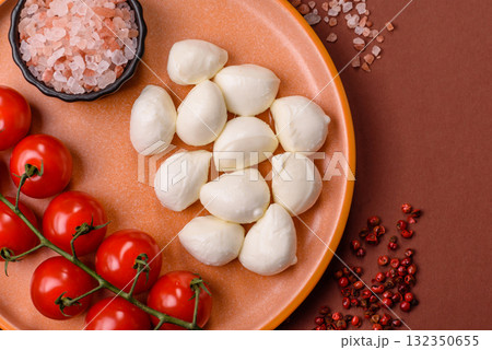 Mozzarella cheese balls, fresh white mini slices for Mediterranean food. Mozzarella cheese 132350655