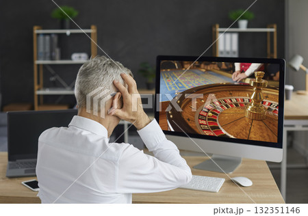 Unlucky gambler plays an online casino game on his computer and loses all his money Unlucky gambler plays an online casino game on his computer and loses all his money 132351146