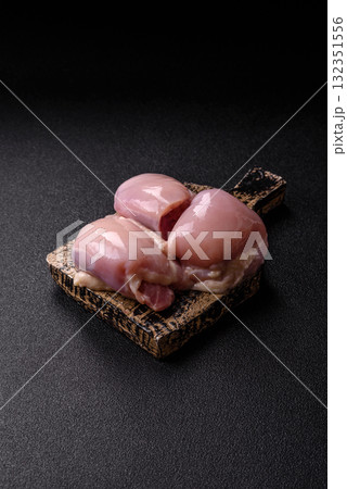 Chicken or turkey raw thigh fillet, skinless and boneless poultry meat. Chicken thigh fillet Chicken or turkey raw thigh fillet, skinless and boneless poultry meat. Chicken thigh fillet 132351556
