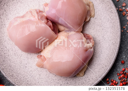 Chicken or turkey raw thigh fillet, skinless and boneless poultry meat. Chicken thigh fillet 132351578