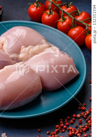 Chicken or turkey raw thigh fillet, skinless and boneless poultry meat. Chicken thigh fillet Chicken or turkey raw thigh fillet, skinless and boneless poultry meat. Chicken thigh fillet 132351594